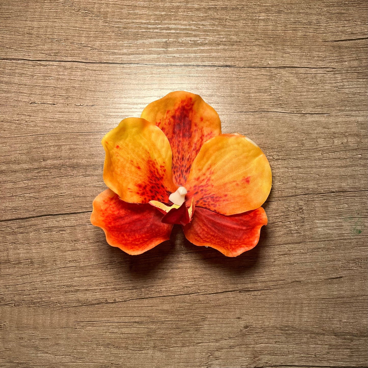 Orange orchid hair clip